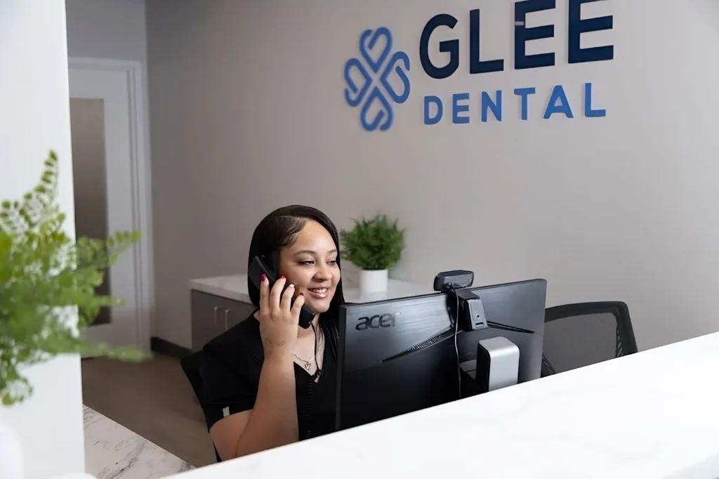 Dr. Ajiboye laying her hand on a blue chair