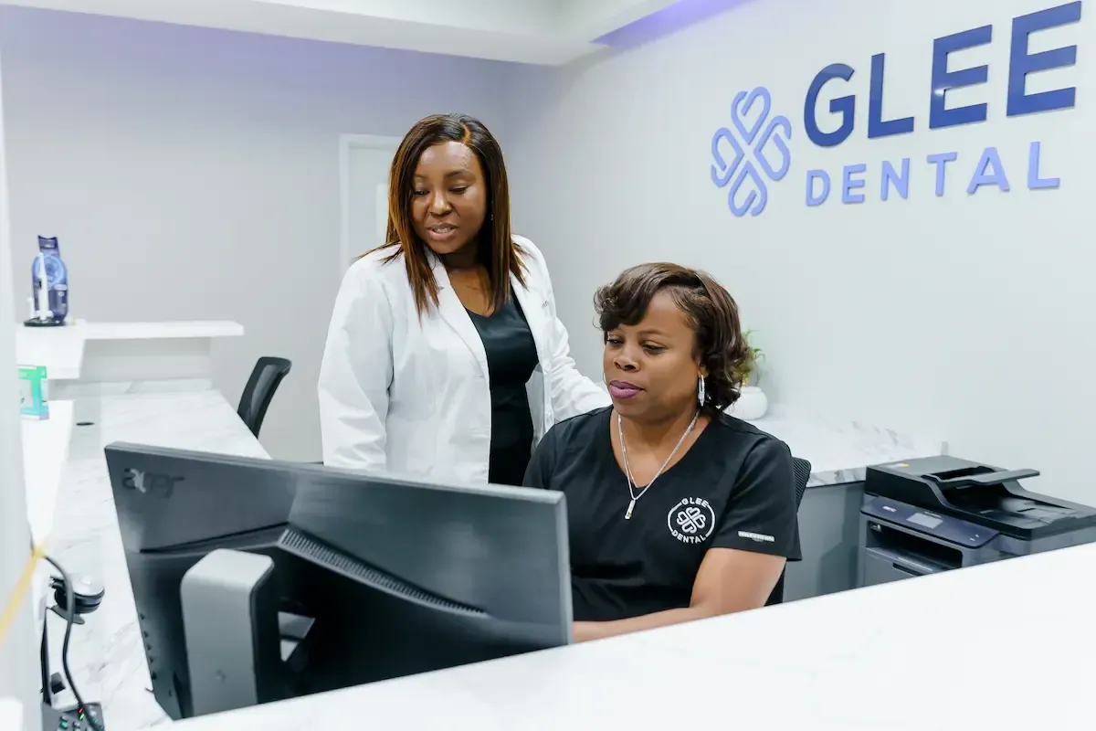 Dr. Ajiboye and other girl looking at a monitor